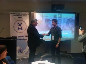 Professor Tim Mazzarol, President of SEAANZ presents Martin Bliemel with the 'Best Paper Award'