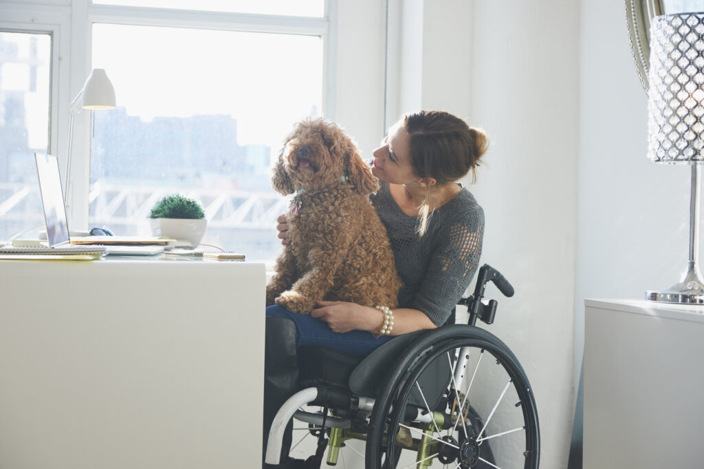 Woman in wheelchair with a dog