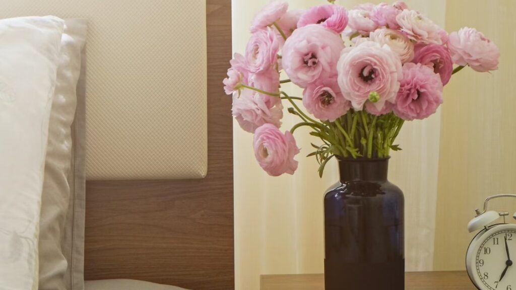 Vase of flowers in a bedroom