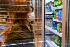 woman wearing a mask while shopping