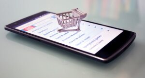 miniature shopping trolley on a mobile phone