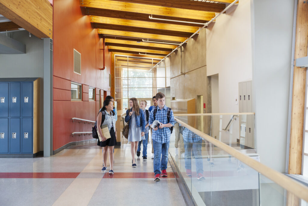 High school students walking through corridors