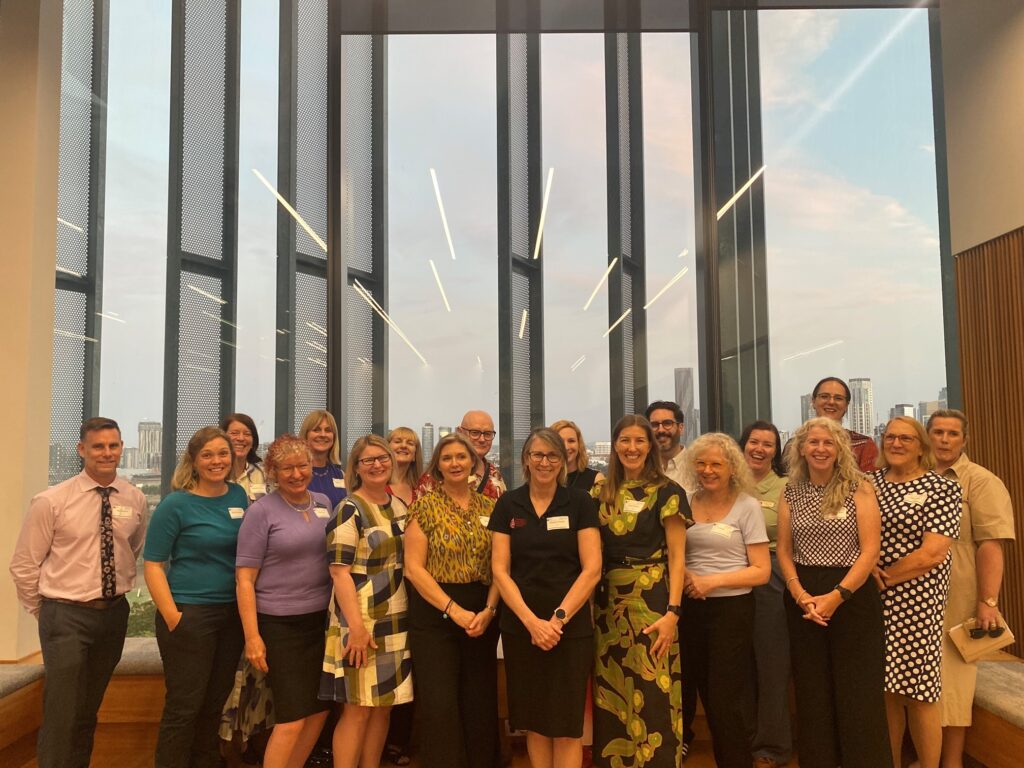 researchers and teachers involved in the project stand in a group and smile