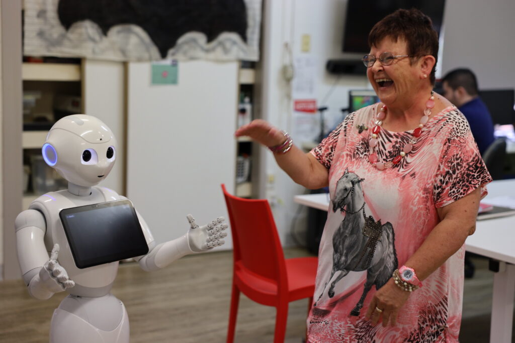 Adult woman interacting with a humanoid robot