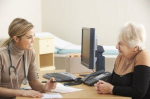 Doctor speaking with woman across a desk