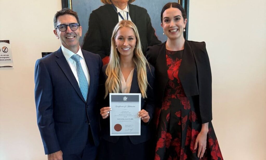 Jones Day Partner Dan Howard and Associate Sophie Macleod congratulate Ally Clark on her admission