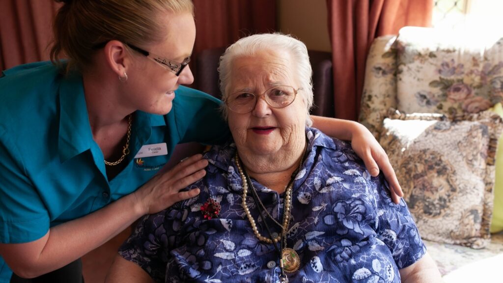 Elderly person with aged care worker