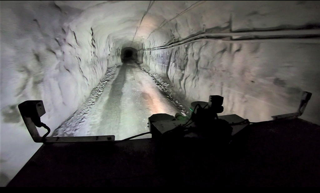Large truck travelling through an underground mine